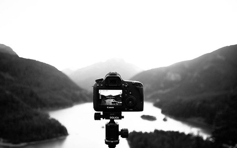 Camera setup on a sturdy tripod configured for manual long-exposure nighttime photography